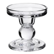 Sklenený svietnik na čajovku s elegantným dizajnom.