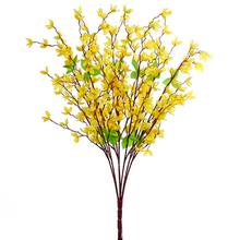 Umelá kytička zlatého dážďa s žltými kvetmi.