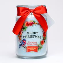 Vianočná voňavá sviečka v skle s červenou stuhou.