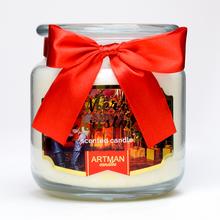 Vianočná voňavá sviečka v skle s červenou mašľou.