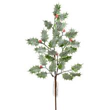 Umelý konár so zelenými listami a červenými bobuľami.
