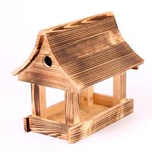 Dlhé krmítko pre vtáky z dreva.