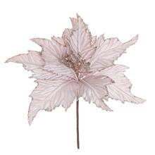 Umelá ruža/poinsettia v ružovej farbe s dekoratívnymi detailmi.