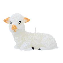 Biely ležiaci baranček sviečka.