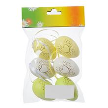 Sada plastových vajíčok v bielej, žltej a zelenej farbe srdcovým vzorom.