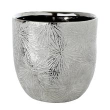 Obal na kvetináč so strieborným vzorom ohňostroja.