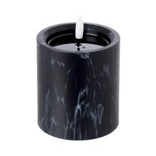 LED sviečka v čiernom mramorovom dizajne.