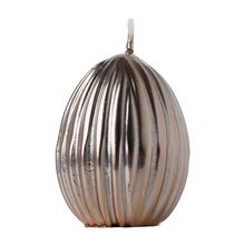 Malé vrúbkavané vajce v rose gold farbe.