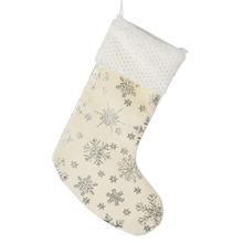 Vianočná ponožka s vzorom vločiek v krémovej farbe.
