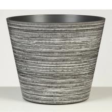Okrúhly mrazuvzdorný kvetináč v šedej farbe.