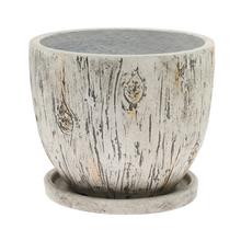 Biely keramický kvetináč s miskou, okrúhly tvar.