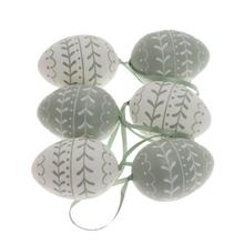 Sada plastových vajíčok v mentolovej a bielej farbe.