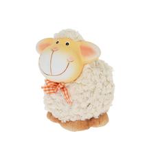 Ovečka s usmievavou tvárou a oranžovou mašľou.