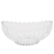 Priehľadná sklenená misa s vlnitým okrajom.