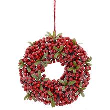 Vianočný veniec s červenými šípkami a imelom.