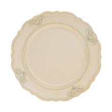 Krémsky plastový tanier s ornamentom, priemer 33 cm.