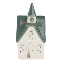 Biely a zelený porcelánový kostolík na sviečku.