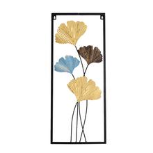 Obraz Ginko z kovu v zlatej farbe s modrými a hnedými detailmi.