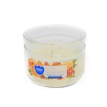 Aromatická sviečka v skle s vôňou pomaranča.