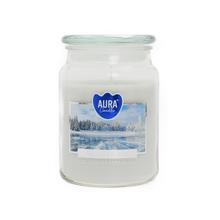 Aromatická sviečka v skle s zimnou krajinou na etikete.