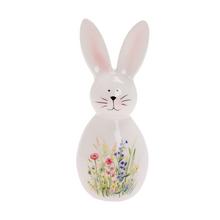 Biely porcelánový zajačik s kvetinovým vzorom.