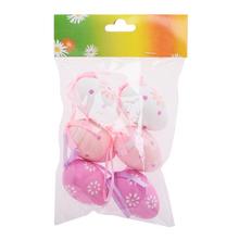 Sada plastových vajíčok v rôznych farbách a vzoroch.