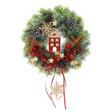 Vianočné aranžmá s domčekom a dekoráciami.