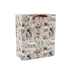 Vianočná papierová taška s motívom zvierat a snehuliakov.