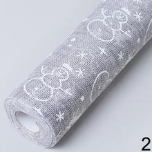 Organza juta s vianočným motívom v šedej a červenej farbe.