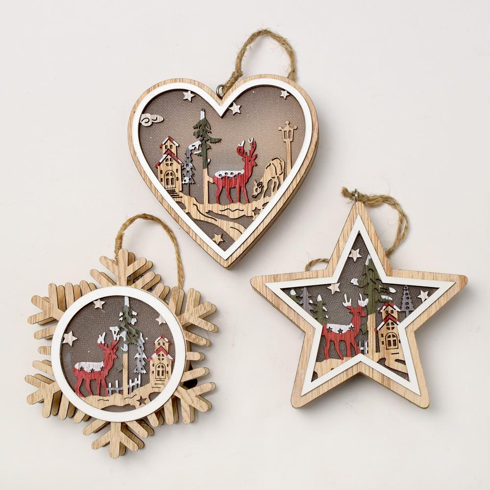 Drevené vianočné dekorácie s LED svetlom v tvare srdca, hviezdy a snežienky.
