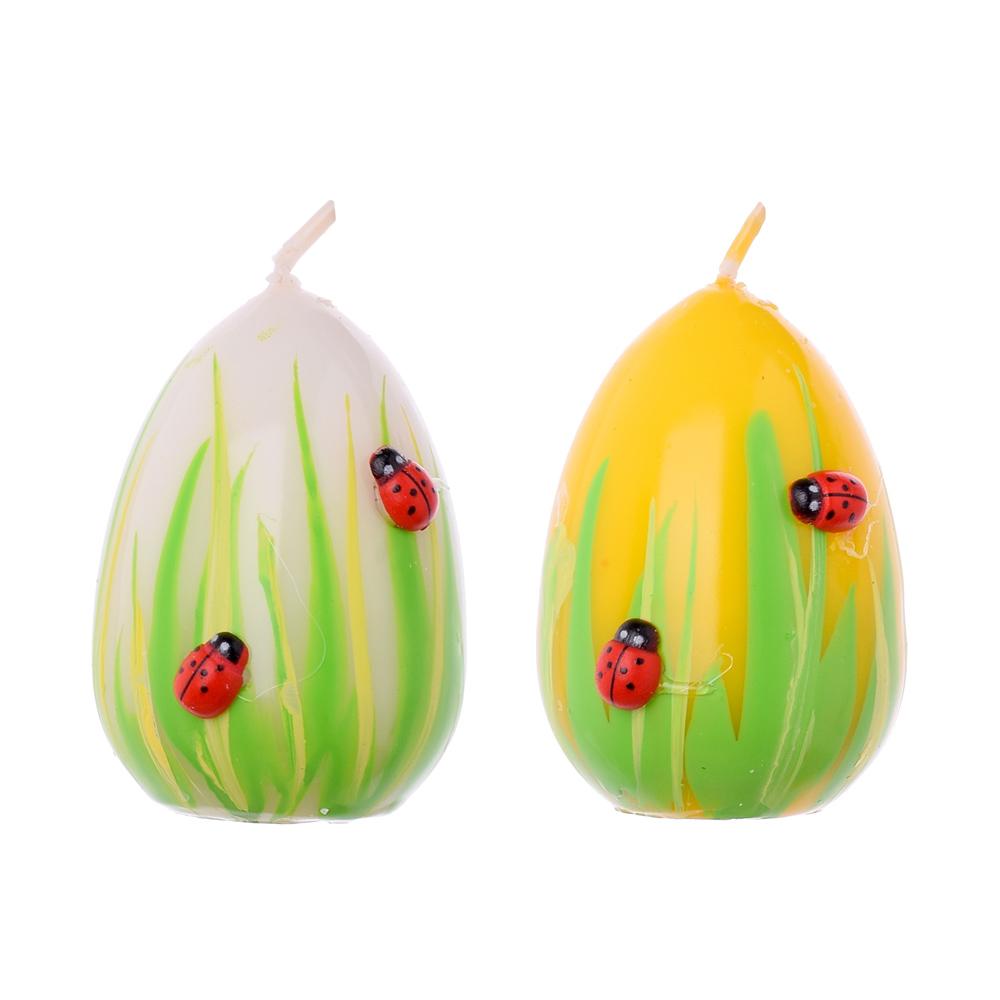 Malé veľkonočné sviečky vo forme vajec s lienkami.