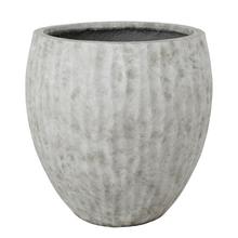 Sivý kvetináč z umelého kameňa s vysokými vlnami.