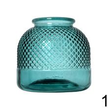 Sklenená váza v modrozelenej farbe s textúrovaným povrchom.