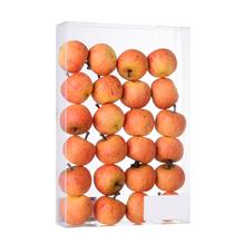 Sada umelých jabĺk v žltej a červenej farbe.