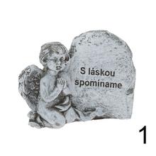 Smutný anjel s pomníkom v sivej farbe.