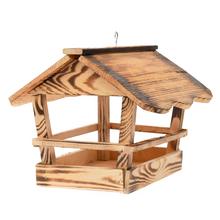 Drevené krmítko pre vtáky s rozmermi 28x22x29 cm.