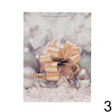 Darčeková taška s vianočným motívom a glitrami.