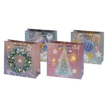 Darčeková taška s vianočnými motívmi a glitrami.