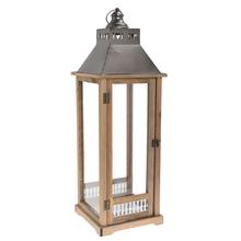 Hnedý lampáš s kovovým vrchom a sklenenými stenami.