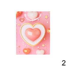 Darčeková taška so srdiečkami v ružových odtieňoch.