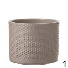Okrúhly keramický obal Era s reliéfom v béžovej farbe.
