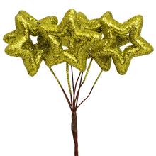 Zlaté glitrové hviezdy na vianočné dekorácie.