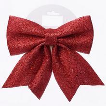 Červená glitrová mašľa na vianočné dekorácie.