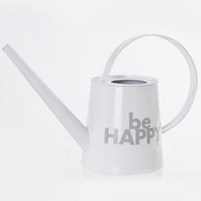 Biela krhlička s nápisom 'be HAPPY'.