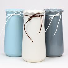 Obal váza mašľa mix v modrej, bielej a šedej farbe.