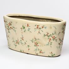 Keramický obal hrantík s kvetinovým vzorom.