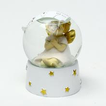 Ťažítko s anjelom v ružovej farbe.