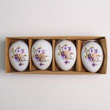 Sada plastových vajíčok s kvetinovým vzorom v bielo-fialovej farbe.