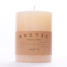 Krémska metalická sviečka RUSTIC v tvare valca.