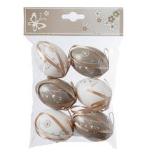 Sada plastových vajíčok s kvetinovým vzorom v hnedej a bielej farbe.